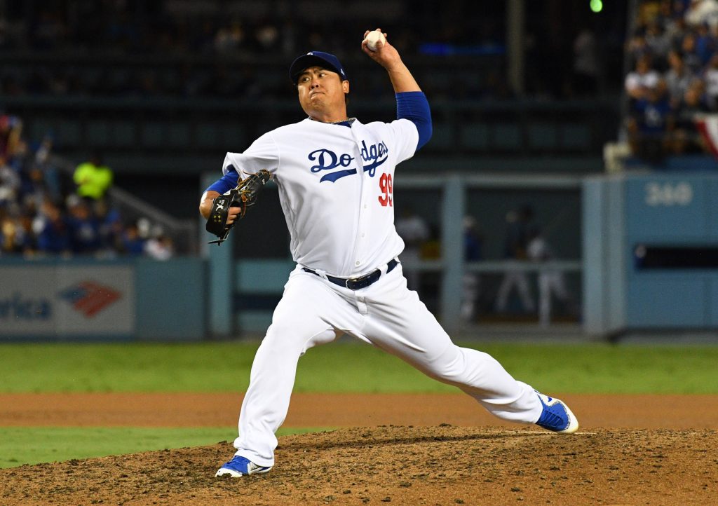Ryu Hyunjin Dodgers pitcher in number 99 uniform pitching under bright stadium lights wallpaper