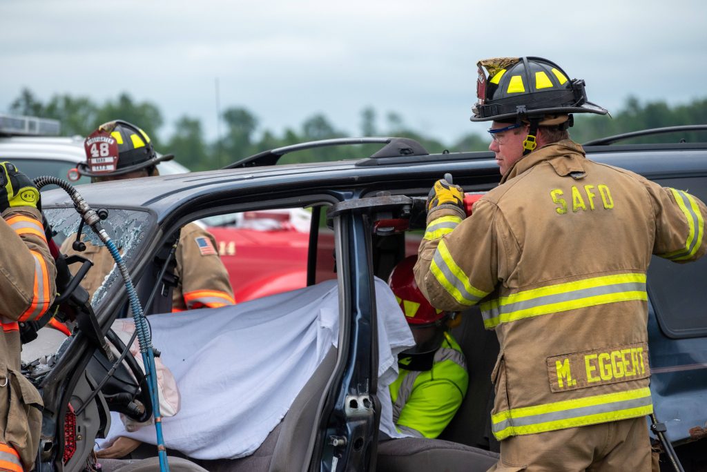 SAFD firefighters Eggert and Barr performing vehicle extrication rescue at accident scene wallpaper