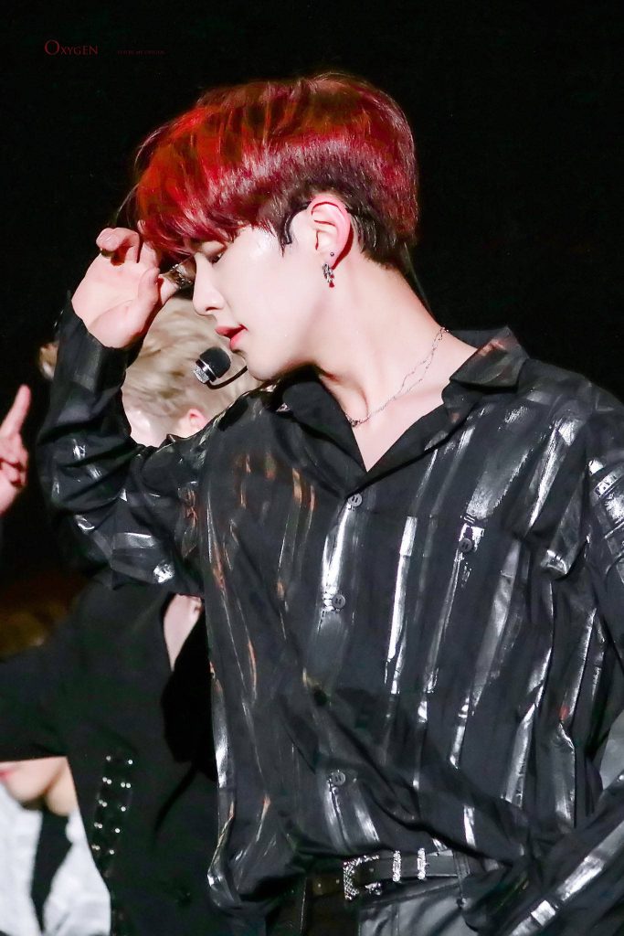 SEVENTEEN Hoshi intense red hair performance black metallic stage outfit dark background wallpaper