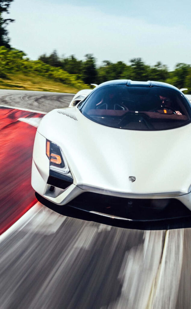 SSC Tuatara White Diamond racing on track showcasing sleek design and high performance car Wallpaper
