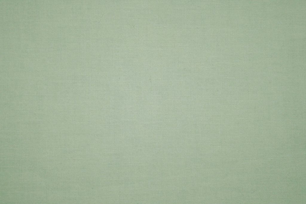 Close-up of sage green woven fabric texture minimalist calming wallpaper background design