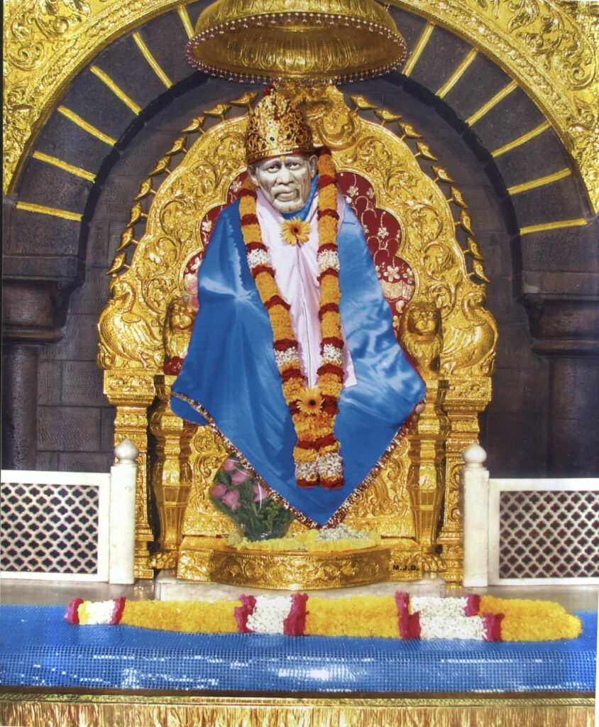 Shirdi Sai Baba on golden throne in blue robe with floral garlands spiritual HD wallpaper