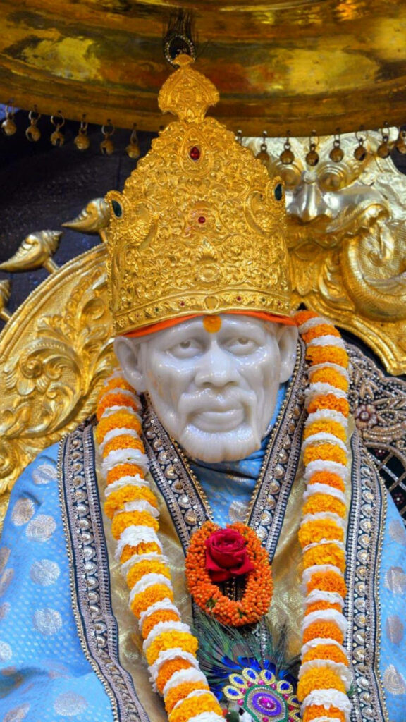 Sai Baba's Divine Presence: HD Wallpaper with Garland and Crown