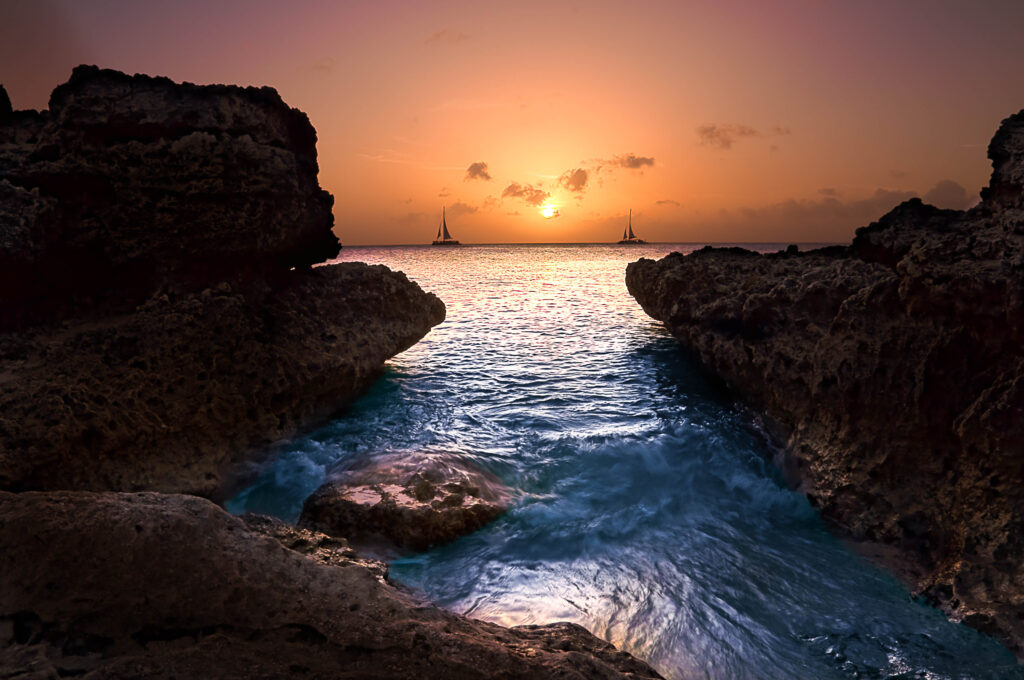 Horizon Dreams: Capturing the Majestic Beauty of Sailboats in the Sunset Wallpaper