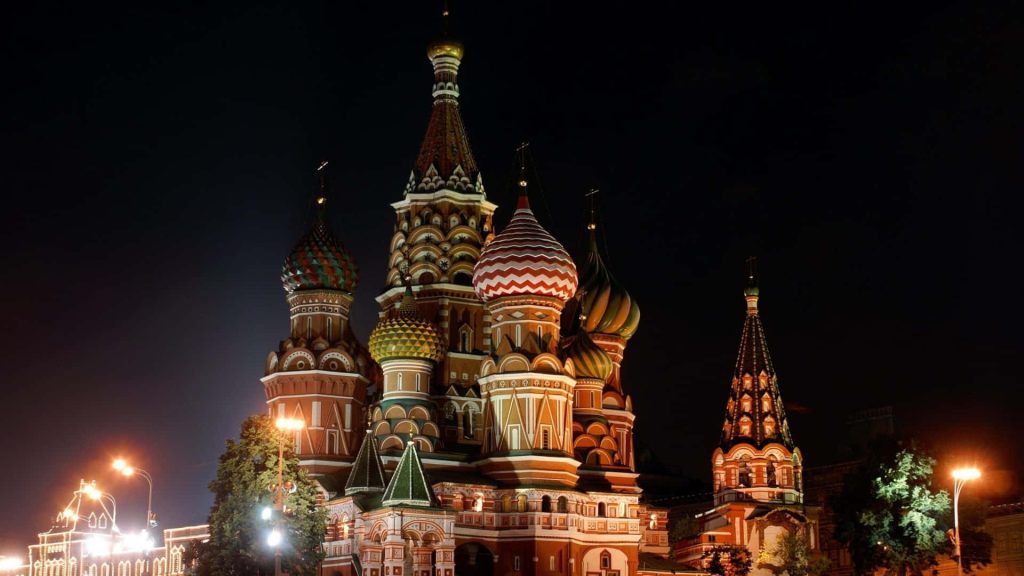 Saint Basil's Cathedral night view with colorful illuminated onion domes in Moscow skyline Wallpaper