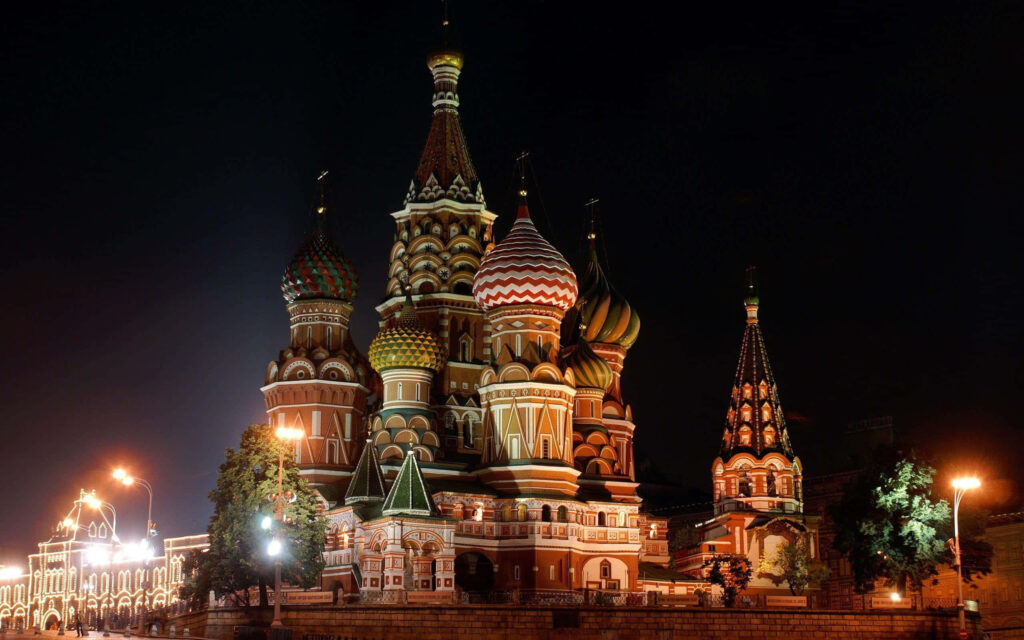 Saint Basil's Cathedral illuminated at night Moscow skyline wallpaper background vibrant colors