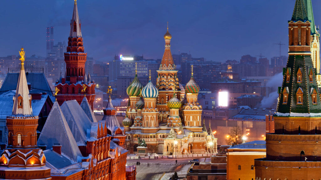 Saint Basils Cathedral illuminated at night with colorful domes in Red Square Moscow wallpaper