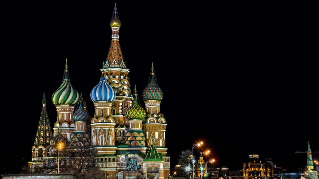 Saint Basils Cathedral vibrant domes glowing at night Moscow intricate architecture wallpaper