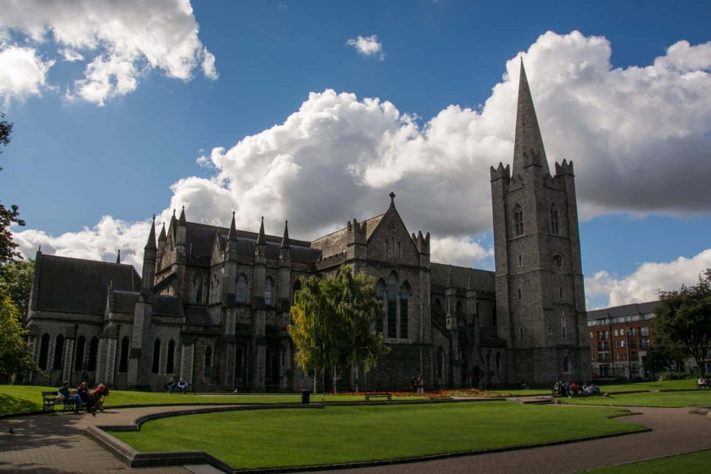 Saint Patricks Cathedral Dublin Gothic architecture with blue sky and St Patricks Park background Wallpaper