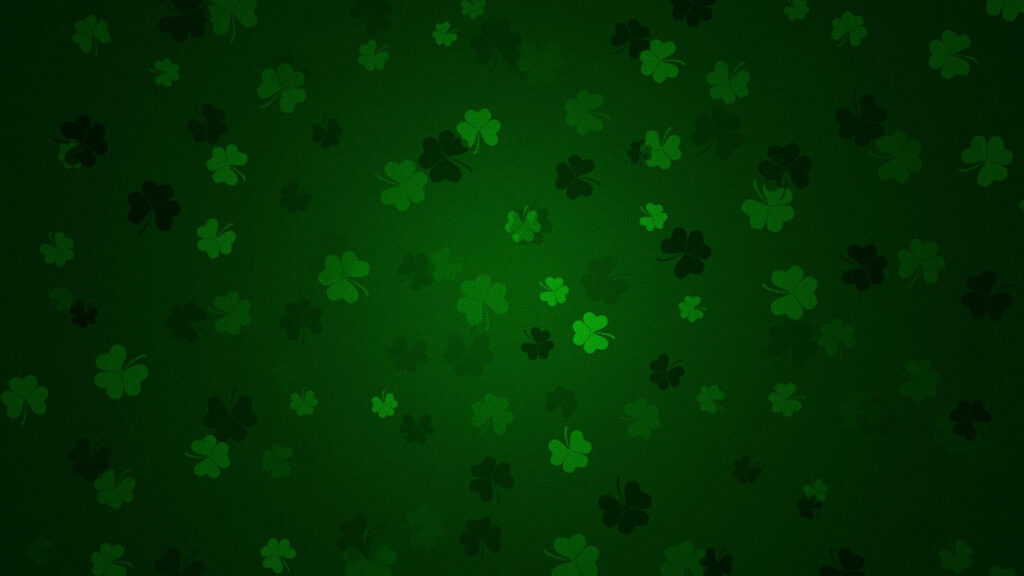 Saint Patricks Day green fabric texture with scattered shamrocks festive wallpaper background