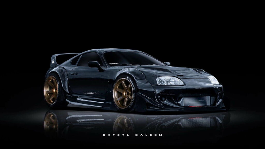 Toyota Supra in Sleek Black: HD Wallpaper of Saleem's Exquisite Side Profile