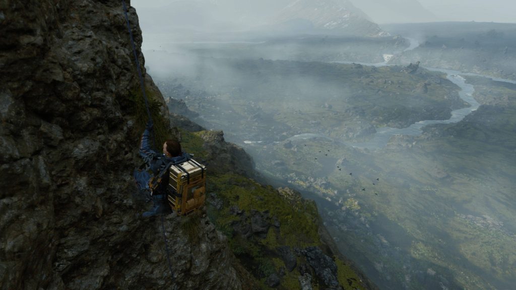 Sam Porter Bridges climbing misty cliff with winding river in Death Stranding scenic landscape wallpaper