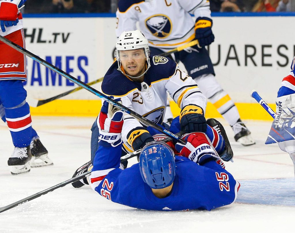 Sam Reinhart Buffalo Sabres battles New York Rangers player intense NHL ice hockey action wallpaper