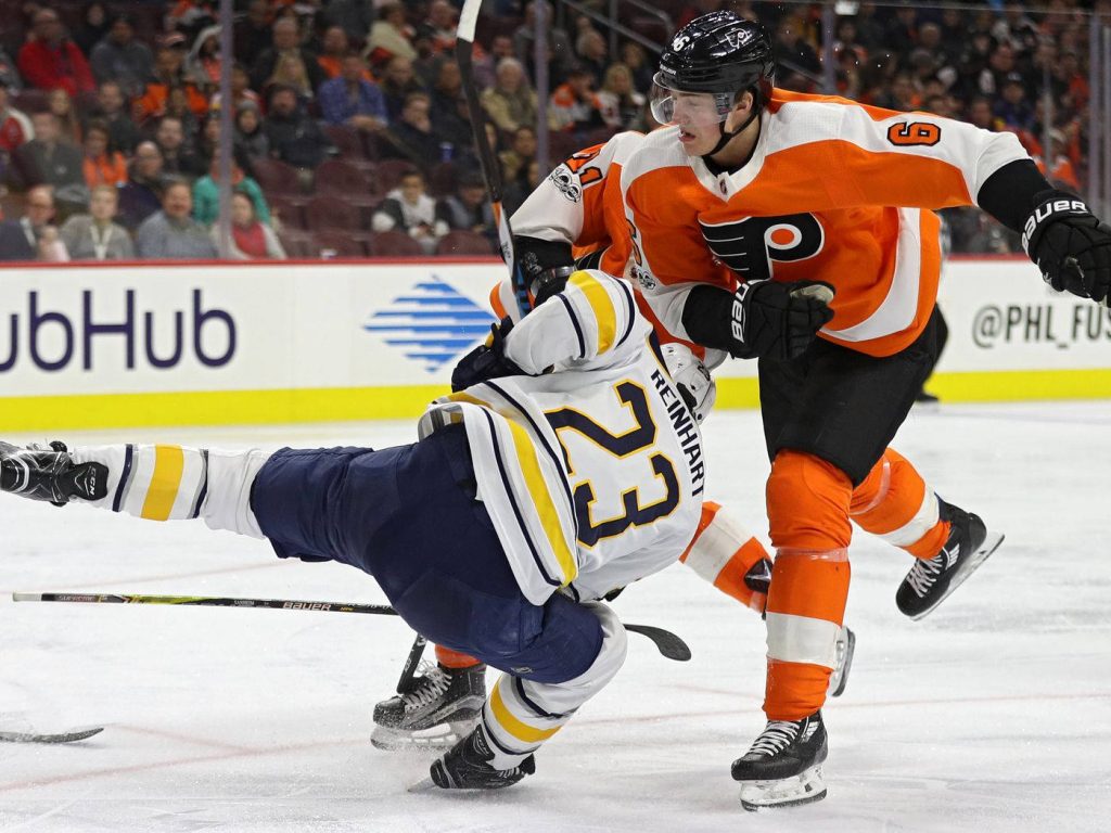 Buffalo Sabres Sam Reinhart battles Philadelphia Flyers player in intense NHL hockey action wallpaper