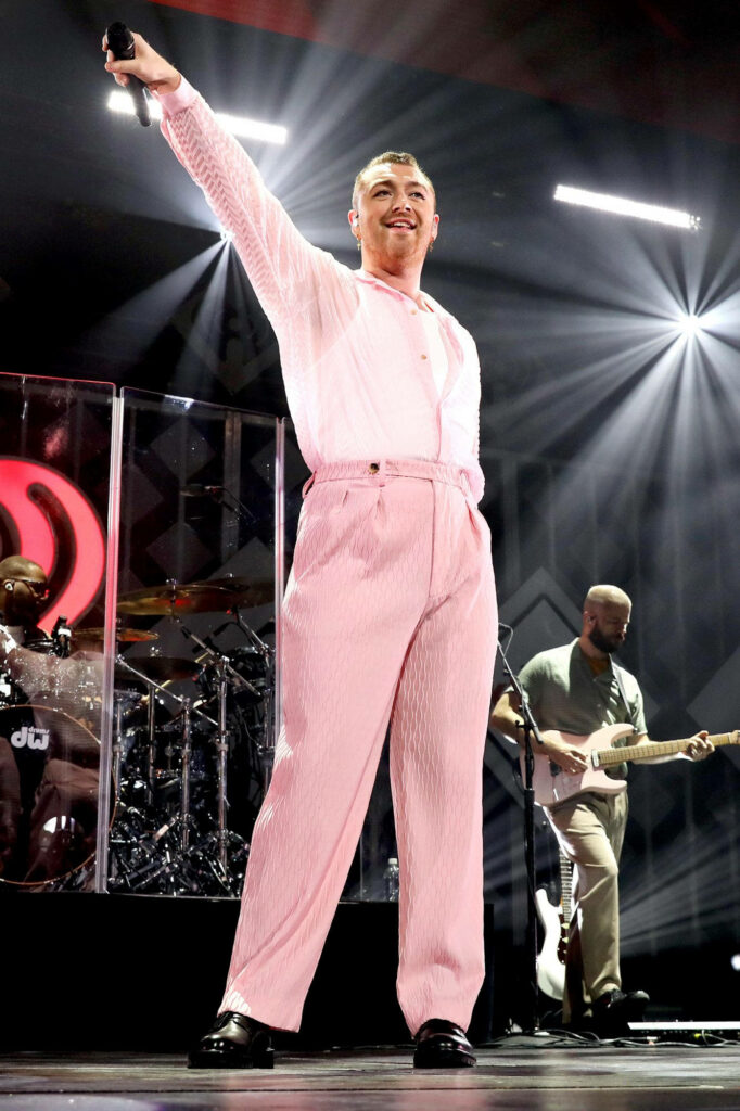 Sam Smith: Stylish Pink Outfit Performance - Vibrant Stage Wallpaper
