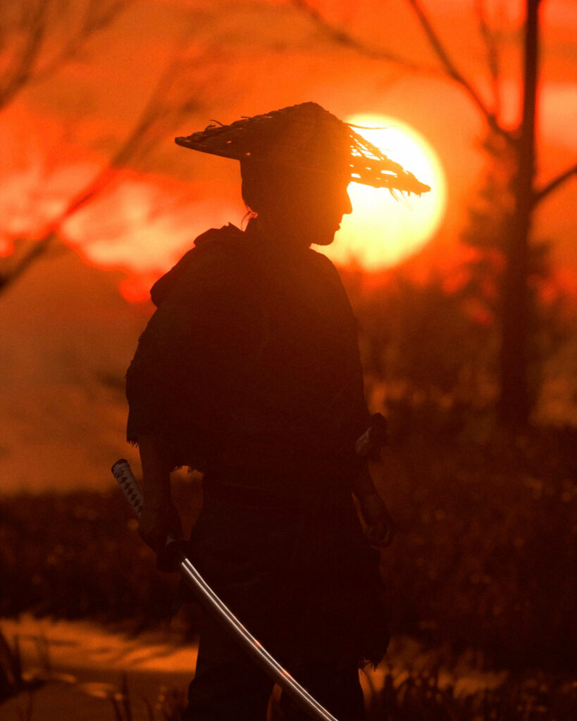 Samurai in the Sunset: The Majestic Silhouette of a Hat-Wearing Warrior Yielding a Katana Wallpaper