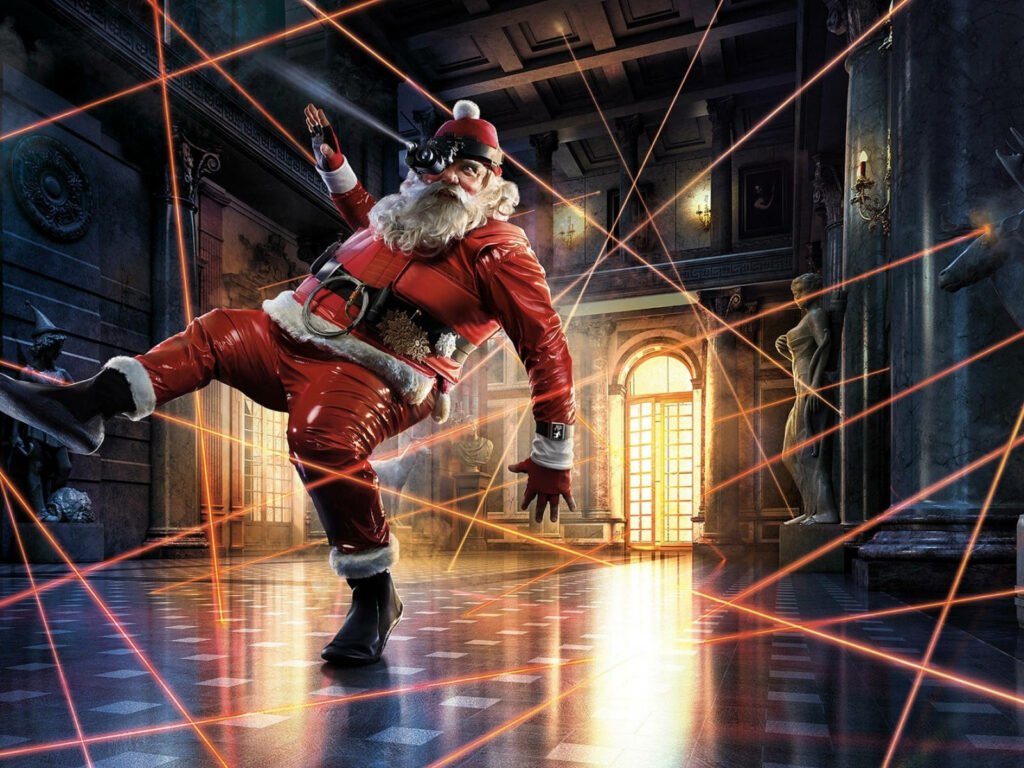 Santa dodging red laser beams in ornate holiday hall action adventure wallpaper background