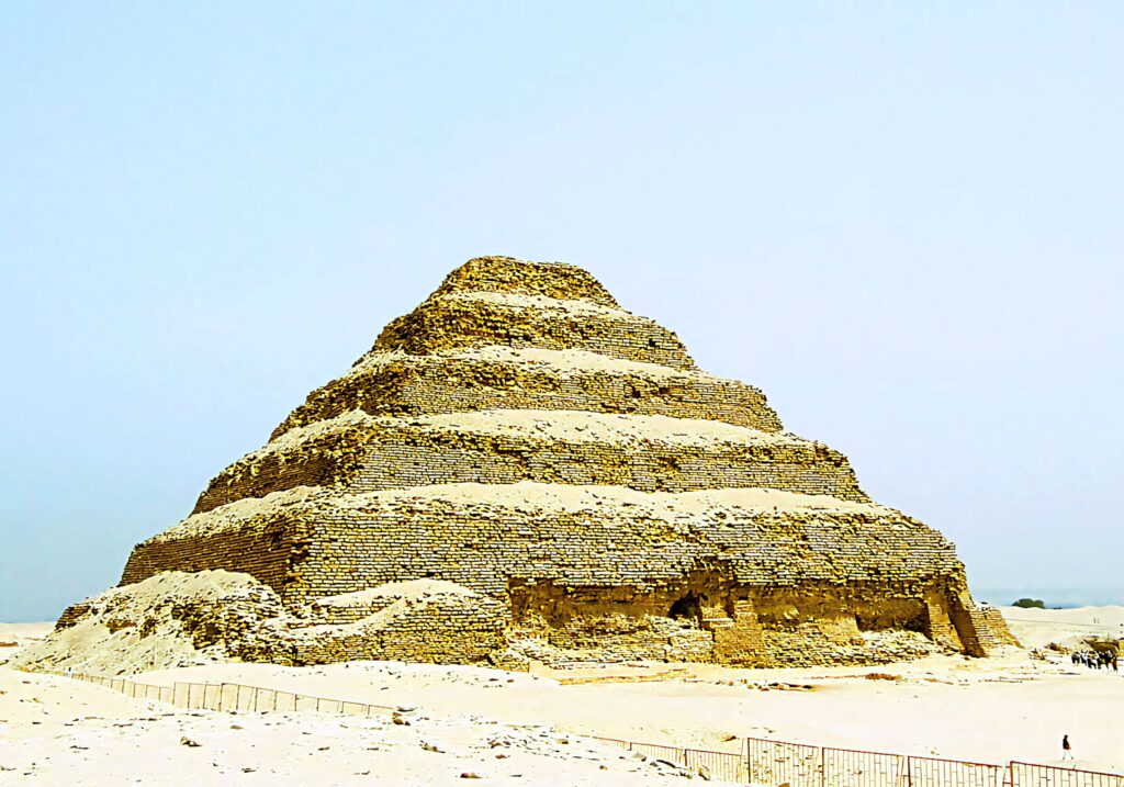 High contrast wallpaper of Saqqara Pyramid Egypt ancient step structure sunlit stone blocks