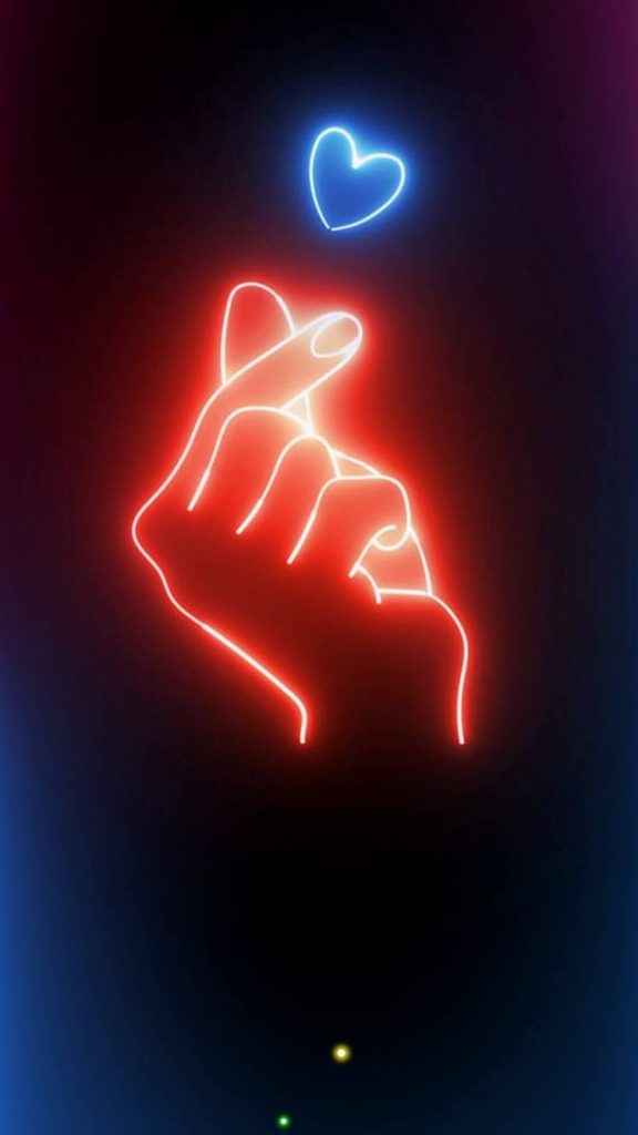 Vibrant Saranghae finger heart neon wallpaper with red hand and blue heart on black background