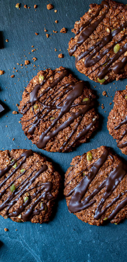 Tempting Chocolate Raisin Cookies Embracing a Rustic Backdrop Wallpaper