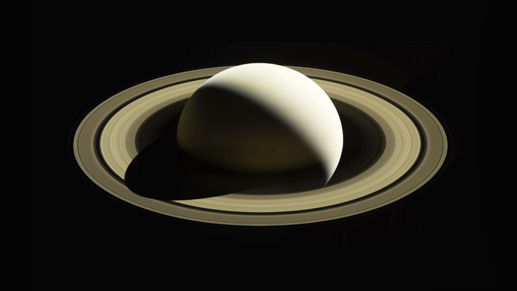 Saturn: Majestic 4k Aerial Capture of Rings Against a Dark Canvas Wallpaper