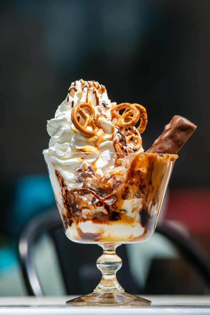 Sundae Extravaganza: Tempting Delights with Snickers, Pretzels, and Luscious Caramel Wallpaper
