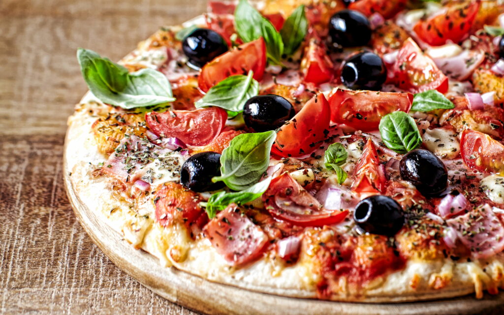 Savory Delight: Gourmet Pizza with Sausage and Olives in 4K Photo Wallpaper