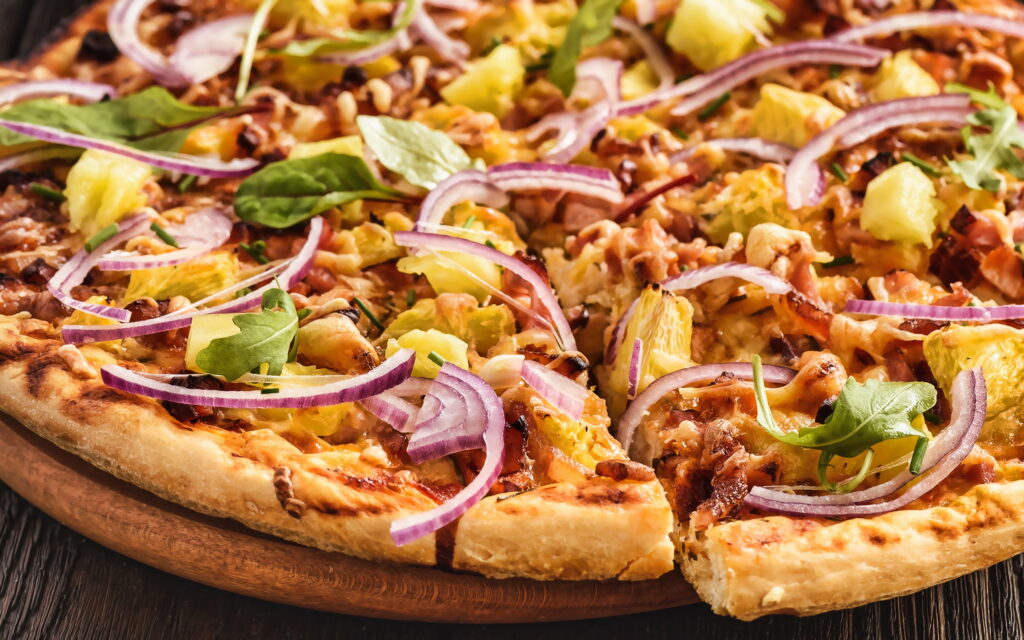 Delicious Combination: Savory Meat and Tropical Pineapple Pizza - A Tempting Fast Food Delight! Wallpaper
