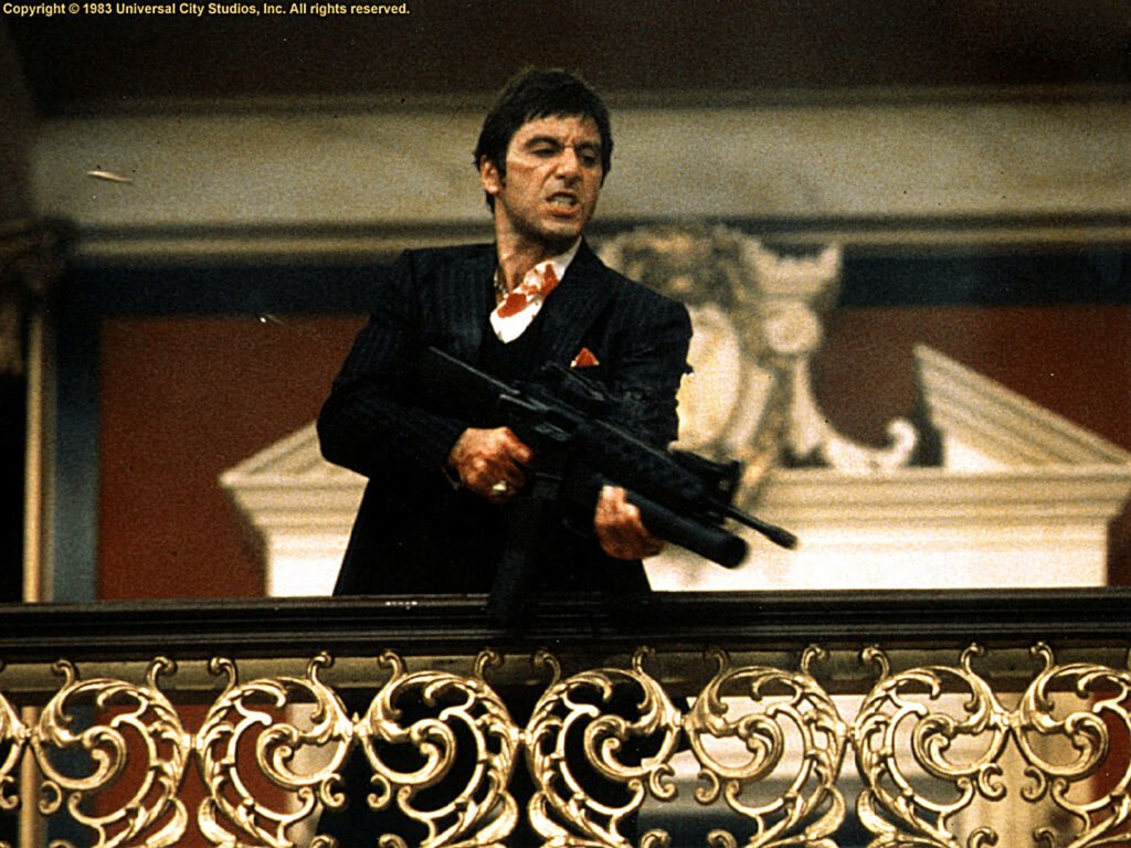 Scarface holding gun intense dramatic scene classic film iconic wallpaper background