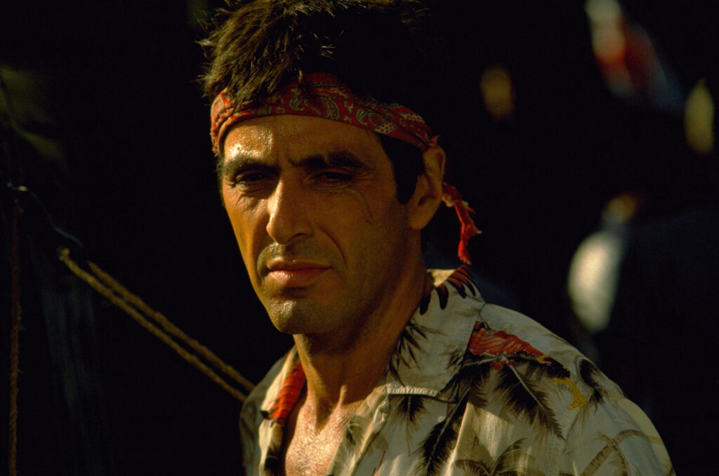 Scarface Tony intense look red bandana patterned shirt dramatic Scarface movie wallpaper background