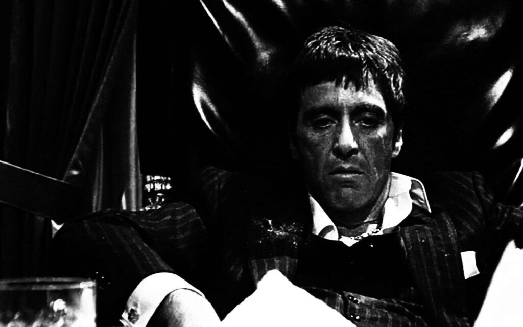 Scarface Tony Montana intense portrait movie wallpaper dark dramatic iconic background