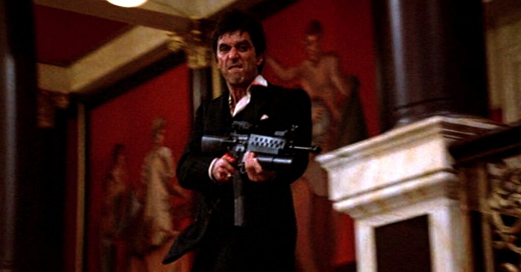 Scarface Tony Montana intense gun scene in mansion dramatic classic film Little Friend wallpaper