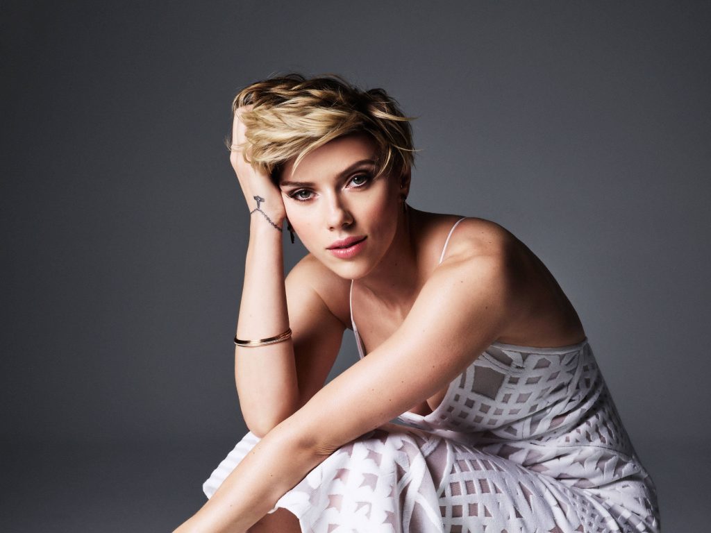 Scarlett Johansson studio portrait with blonde pixie cut in textured white dress on grey background Wallpaper