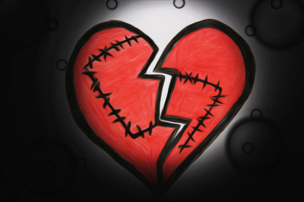 Love Failure scarred red broken heart stitched with black thread on dark background wallpaper