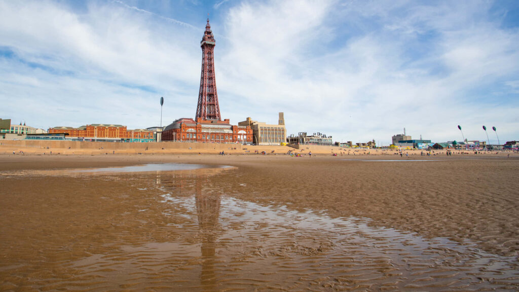Scenic Beach Wallpaper with Blackpool Tower Reflection & Clouds