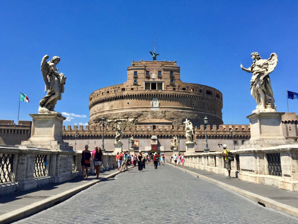Scenic Castel Sant'Angelo: Tourists & Statues Under Blue Sky | Wallpaper