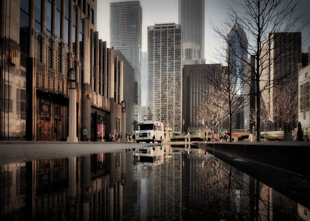 Chicago Urban Skyline Wallpaper: Modern Skyscrapers & Puddle Reflection