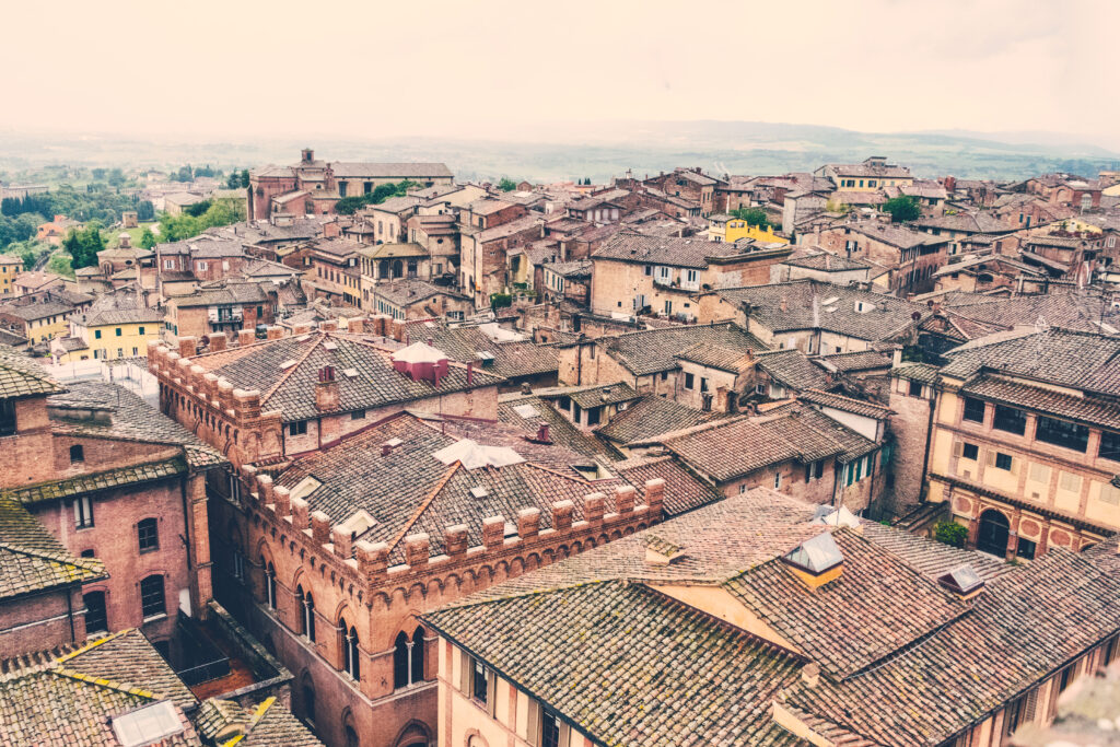 Scenic Historic Cityscape Wallpaper: Terracotta Rooftops & Charm