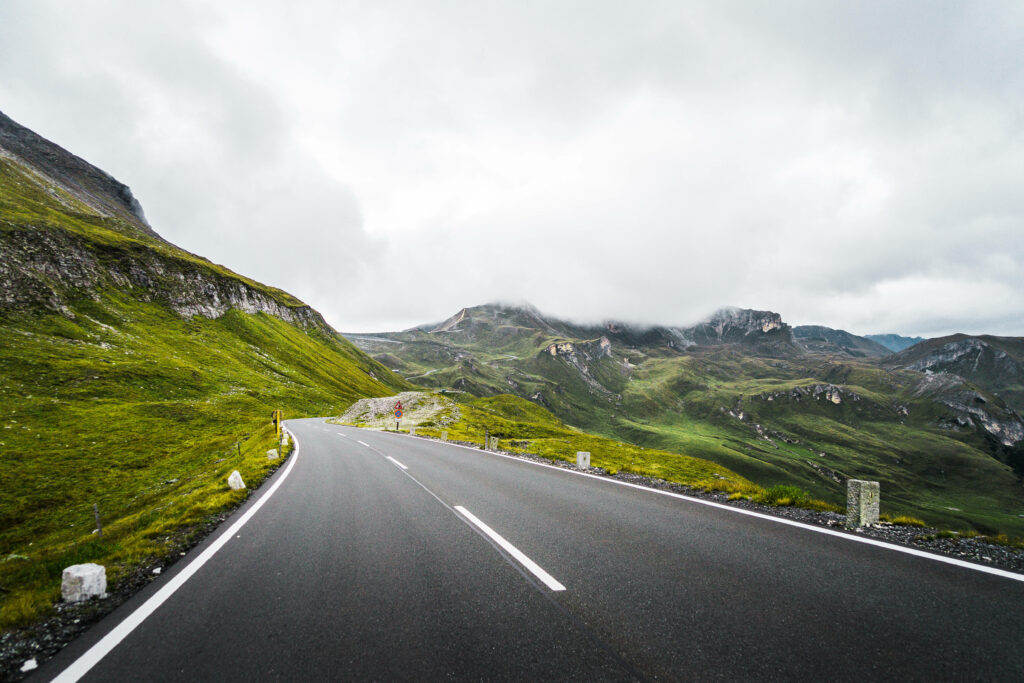 Scenic Serpentine: Capturing the Majestic Grossglockner Road Meandering Through Austria's Alpine Terrain in Stunning 4K Wallpaper
