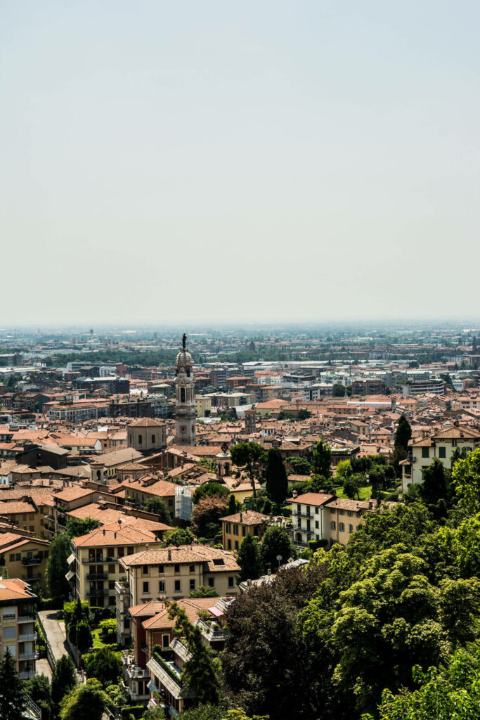 Charming Town with Brick Roofs & Greenery - iPhone Wallpaper