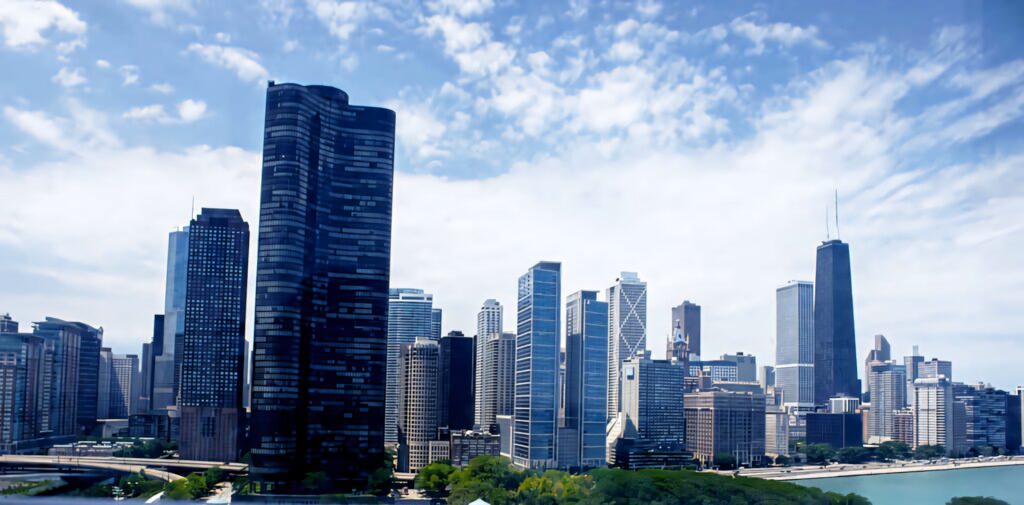 Urban Skyline Wallpaper: Modern Skyscrapers by a Serene Waterfront