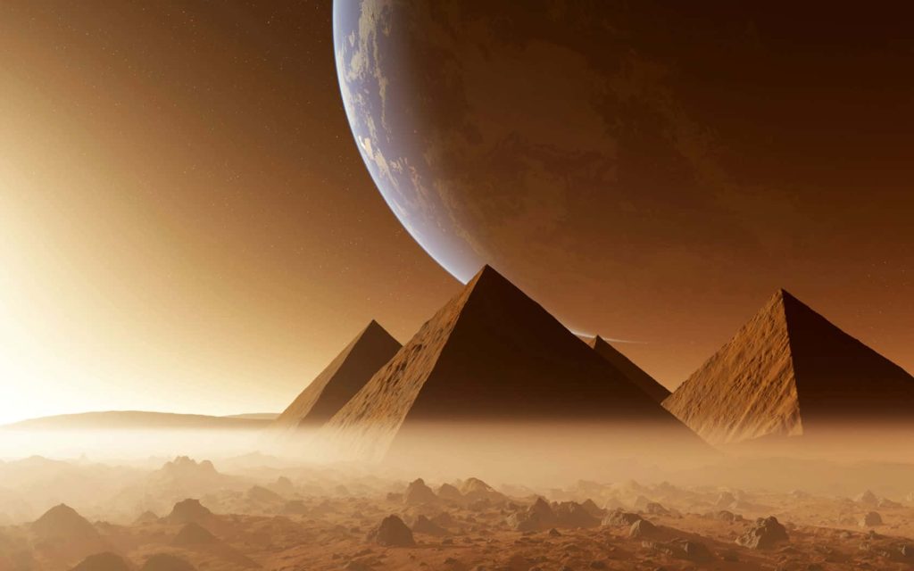 Sci-fi CGI Giza Pyramids on alien desert with mist and giant glowing planet in golden sky Wallpaper