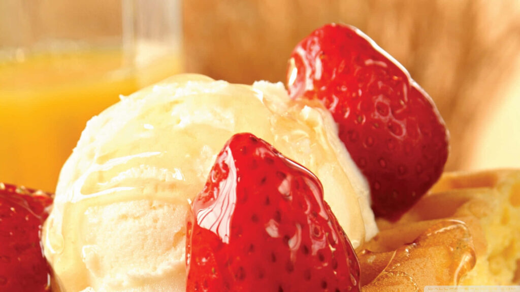 Tempting Vanilla Ice Cream with Fresh Strawberries against Scenic Desserts Backdrop Wallpaper