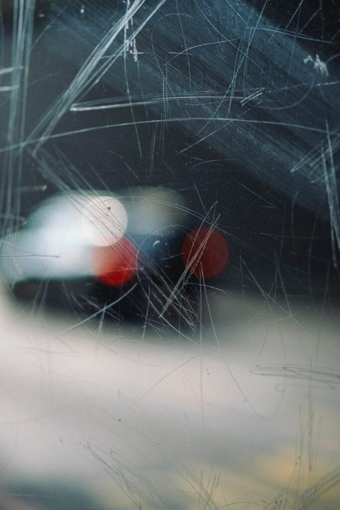 Scratched Glass Wallpaper with Blurred Bokeh Lights & Glare Effect