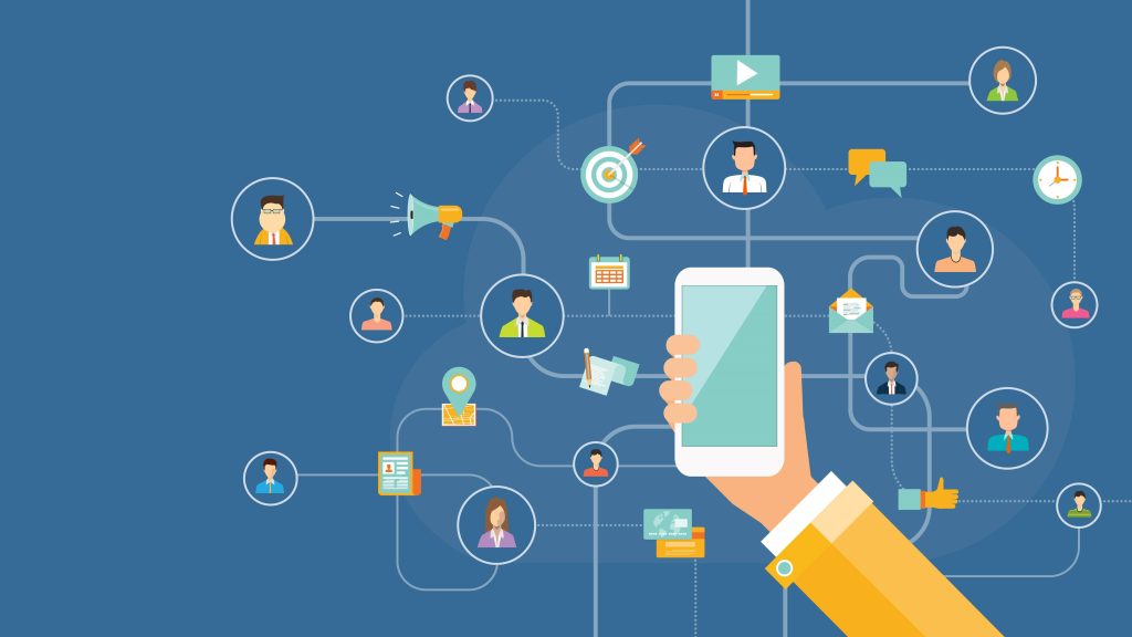 Hand holding smartphone with digital network avatars and business icons on blue background wallpaper