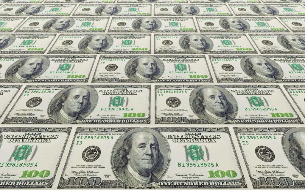 Seamless pattern of US 100 dollar bills wallpaper background representing wealth and currency