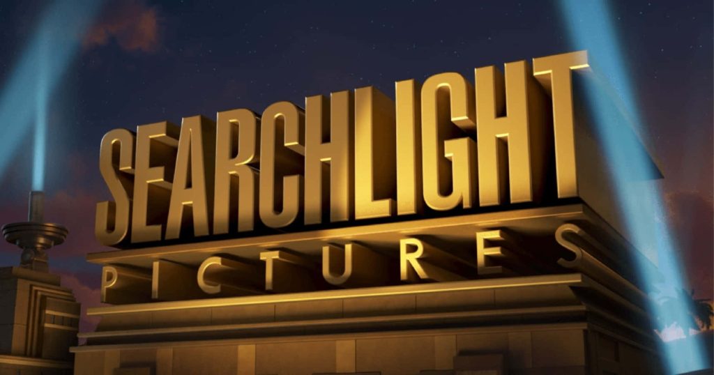 Searchlight Pictures logo golden monument with blue beams against twilight sky cinematic wallpaper