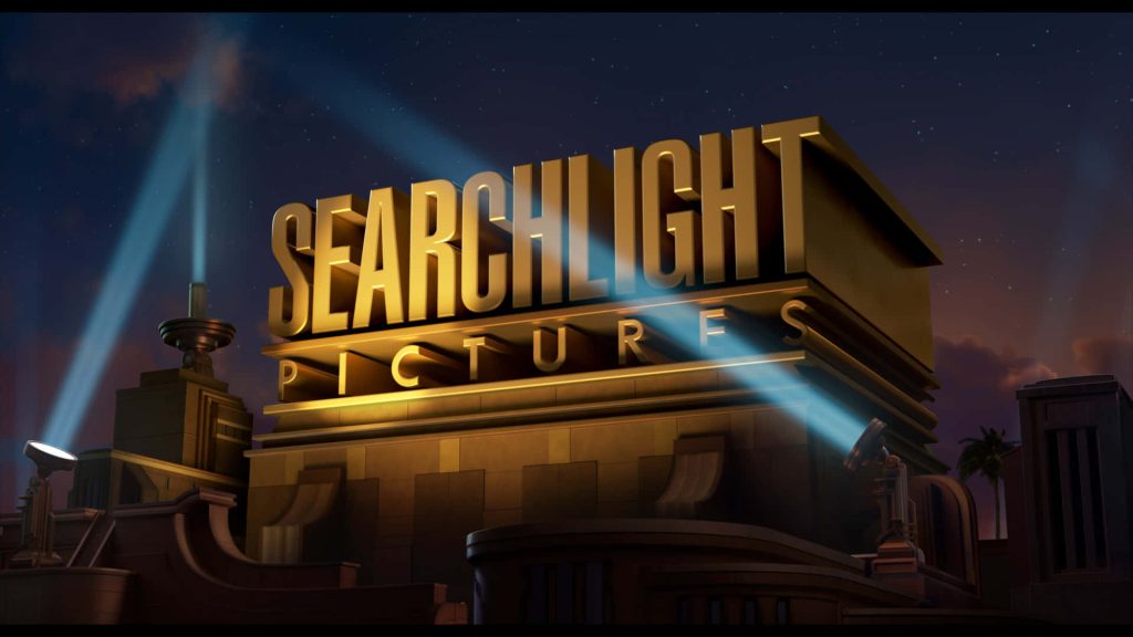 Searchlight Pictures logo glowing in gold on grand structure with blue spotlights and starry sky Wallpaper