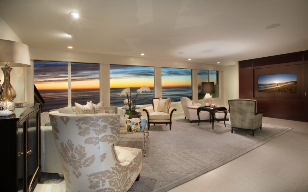A Breathtaking Oceanfront Living Room: Captivating Architecture, Serene View, and Elegant Décor Wallpaper