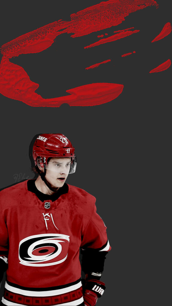 Sebastian Aho Carolina Hurricanes in red uniform dynamic NHL hockey wallpaper background